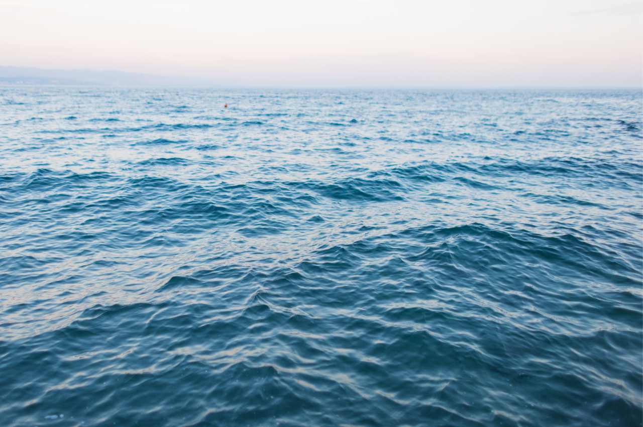 Ocean surface with rippling water patterns in natural light, peaceful seascape for backgrounds or nature themes